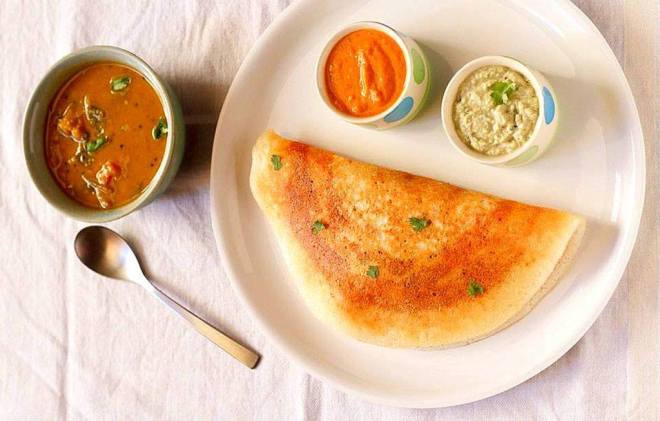 A variant of dosa and a daily breakfast option in Odisha.  9.CHAKULI PITHA Chakuli Pitha is a notable dish of Odisha with a delectable crisp ! It is a rice based fried flat pancake ! It is similar to South Indian dish Dosa ! This is also a great option for those looking to rake in their daily dose of calcium !